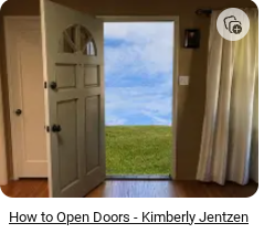 open door with meadow in background